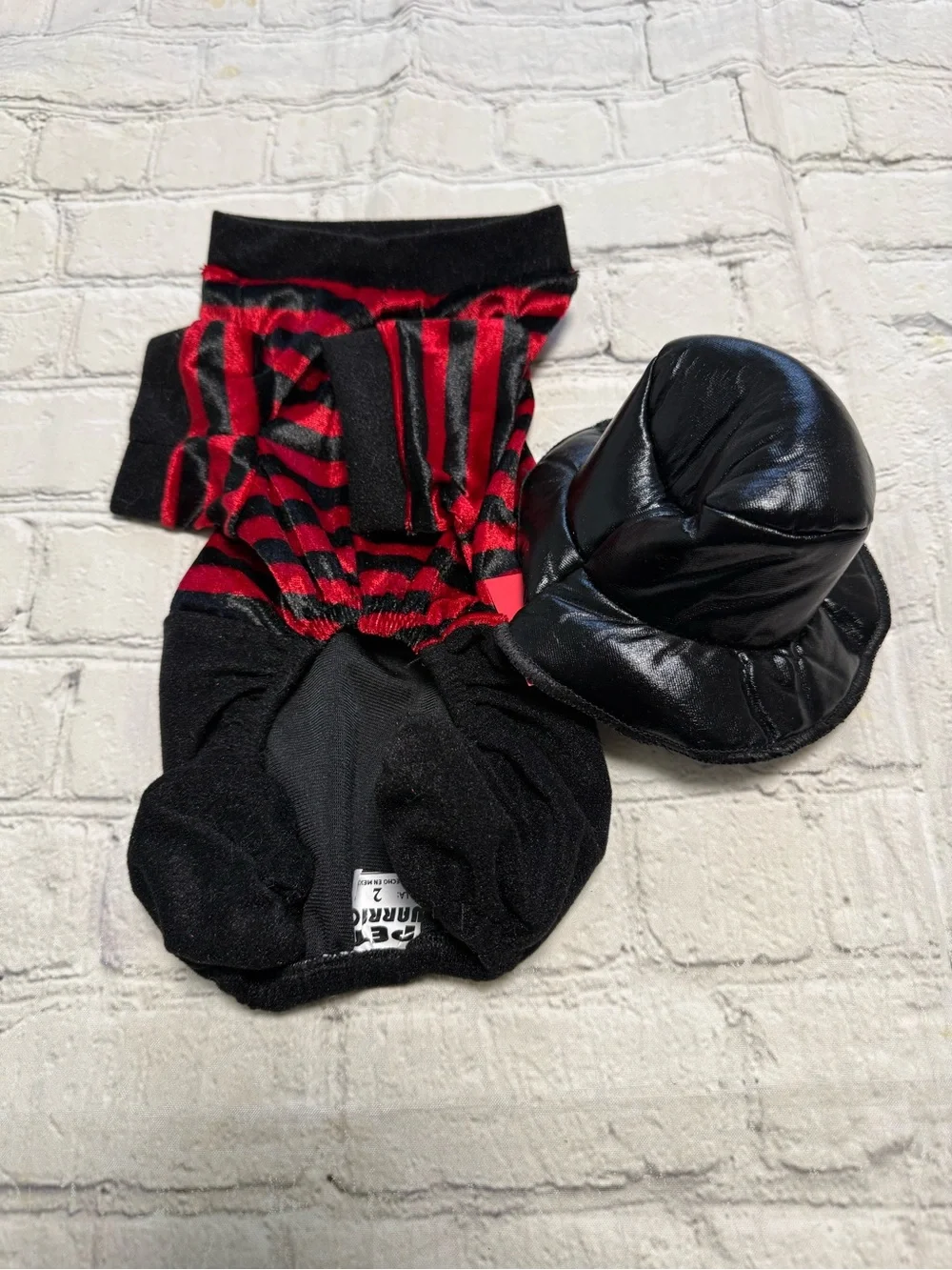 Pet Warrior Dog red and black shirt and black pants custome. Halloween costume.
